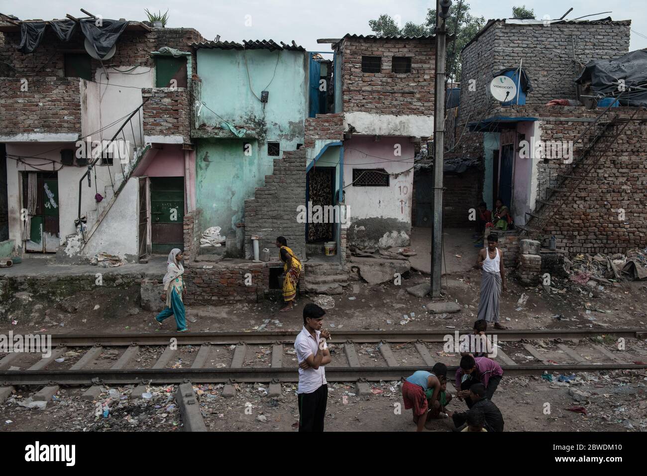 Crowded slums alongside the train tracks. New Delhi, India. India ...