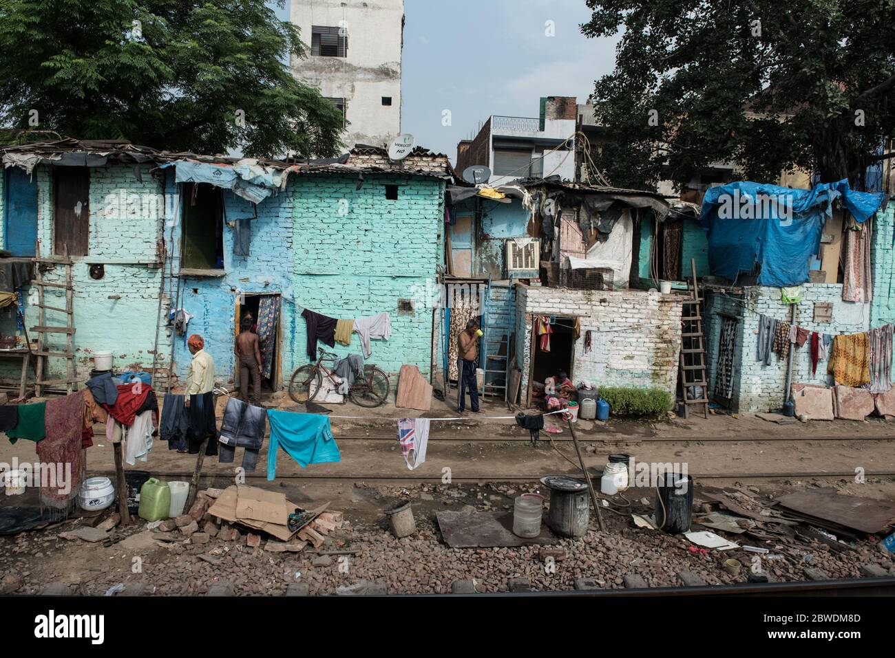 Crowded slums alongside the train tracks. New Delhi, India. India ...
