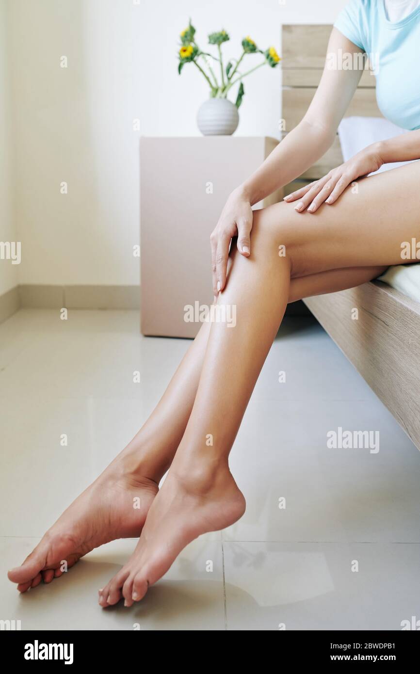 Lotion on her legs hires stock photography and images Alamy