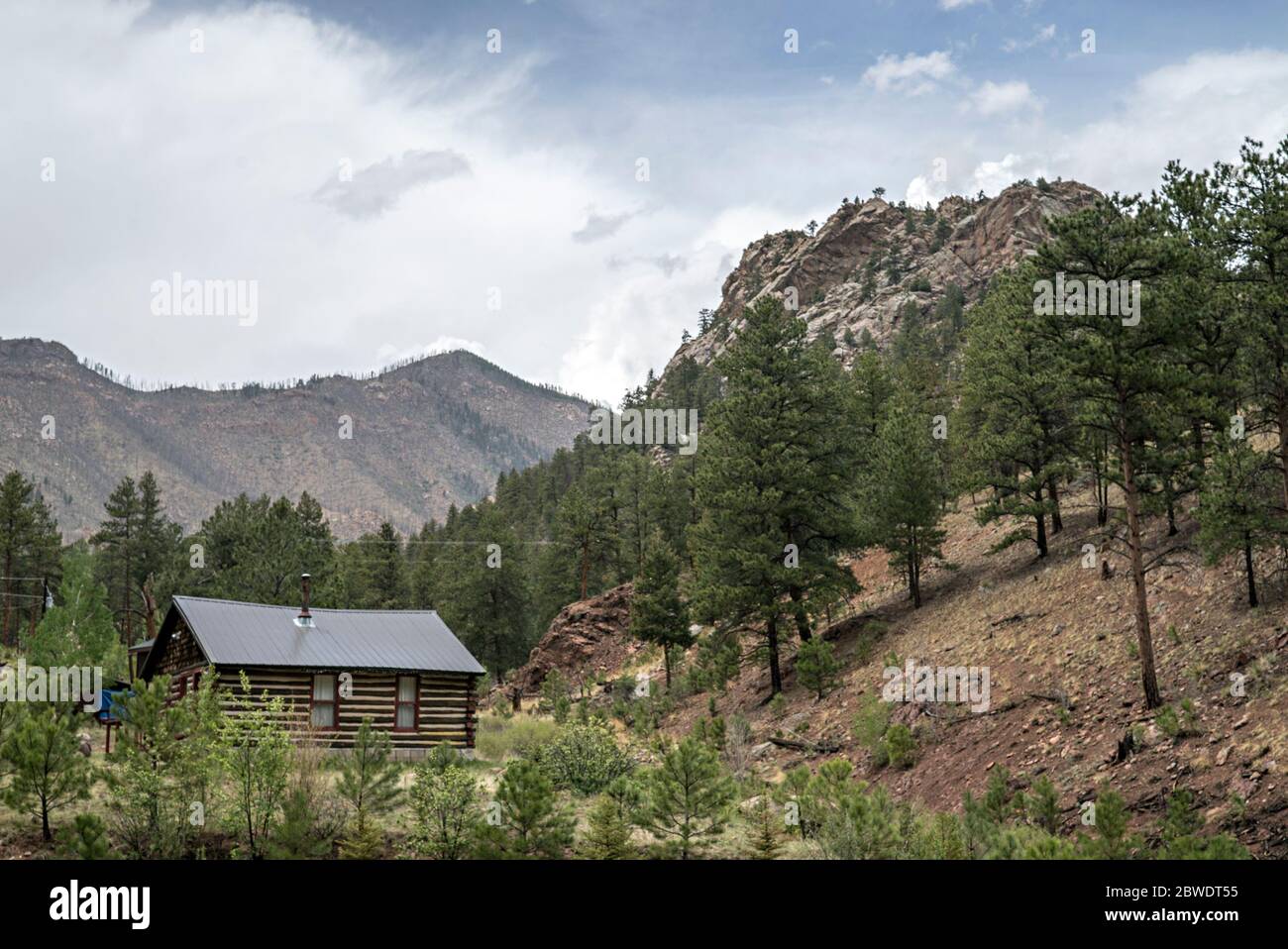 Log Cabin Nestled in the Mountains in the Colorado Wilderness Stock Photo