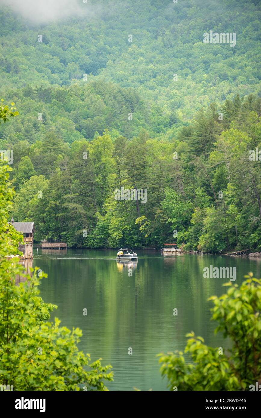 Family enjoying a pontoon boat ride on Lake Rabun in the Northeast