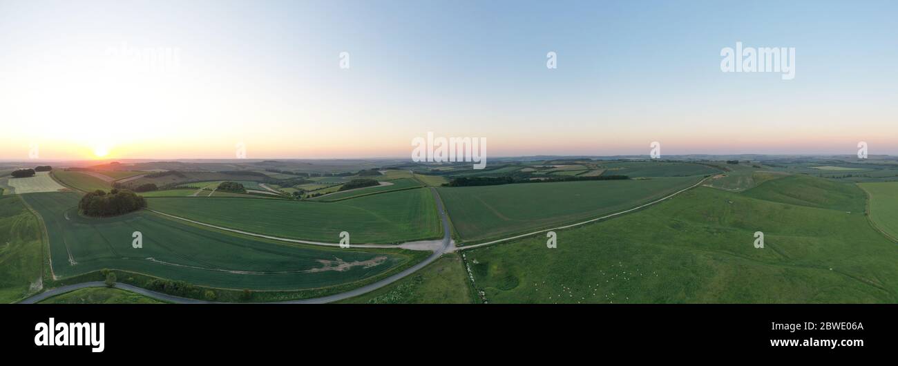 Aerial panorama view of  sunrise over the Ridgway near Swindon, Wiltshire Stock Photo