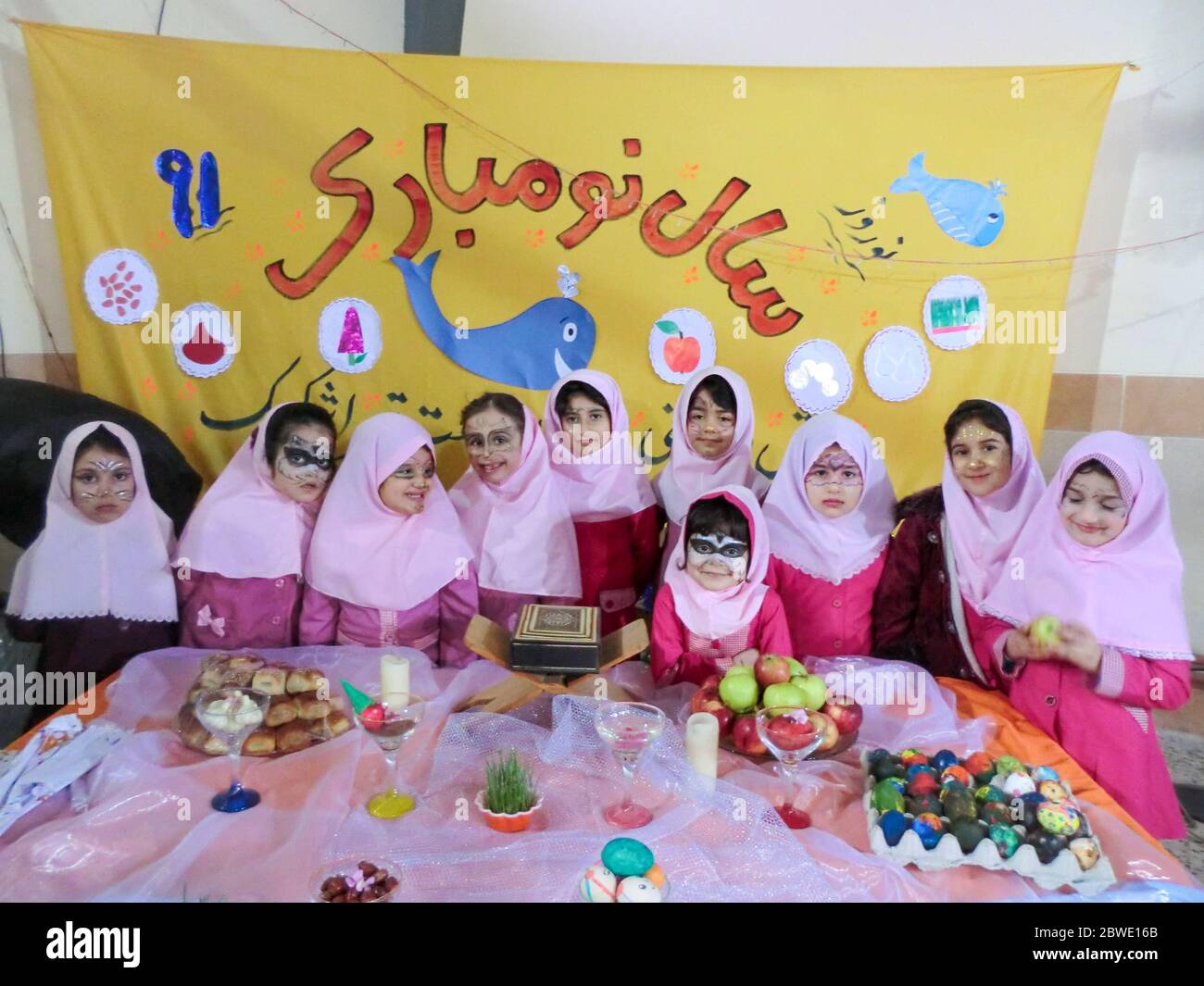 Rasht, Gilan, Iran, 05 05 2019. New Year Celebration at Girls' School in Iran. Nowruz table party with female students. Painted faces of students at t Stock Photo