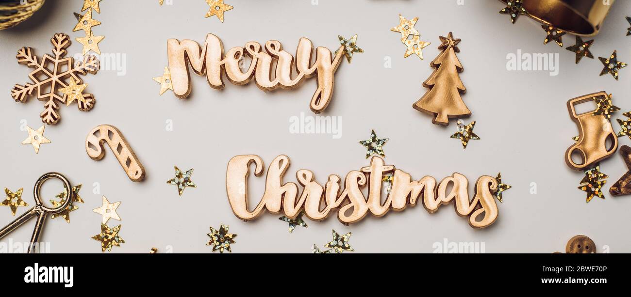 merry Christmas gold  shiny text with luxury xmas decoration items on white table.happy new year holiday concept Stock Photo