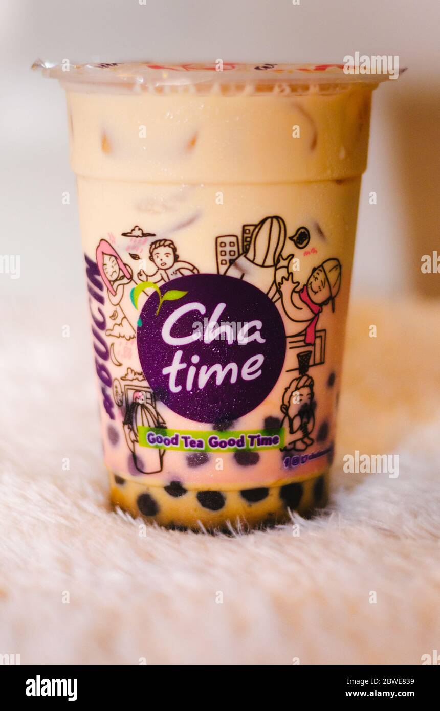An Illustrative Editorial Of The Brown Sugar Fresh Milk Tea Drink From The Chatime Franchise With A Side View Of The Logo Stock Photo Alamy