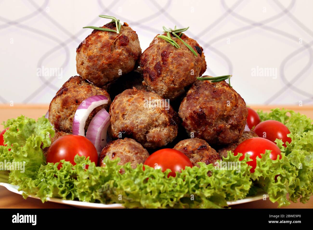 tasty meatballs and salad on plate Stock Photo