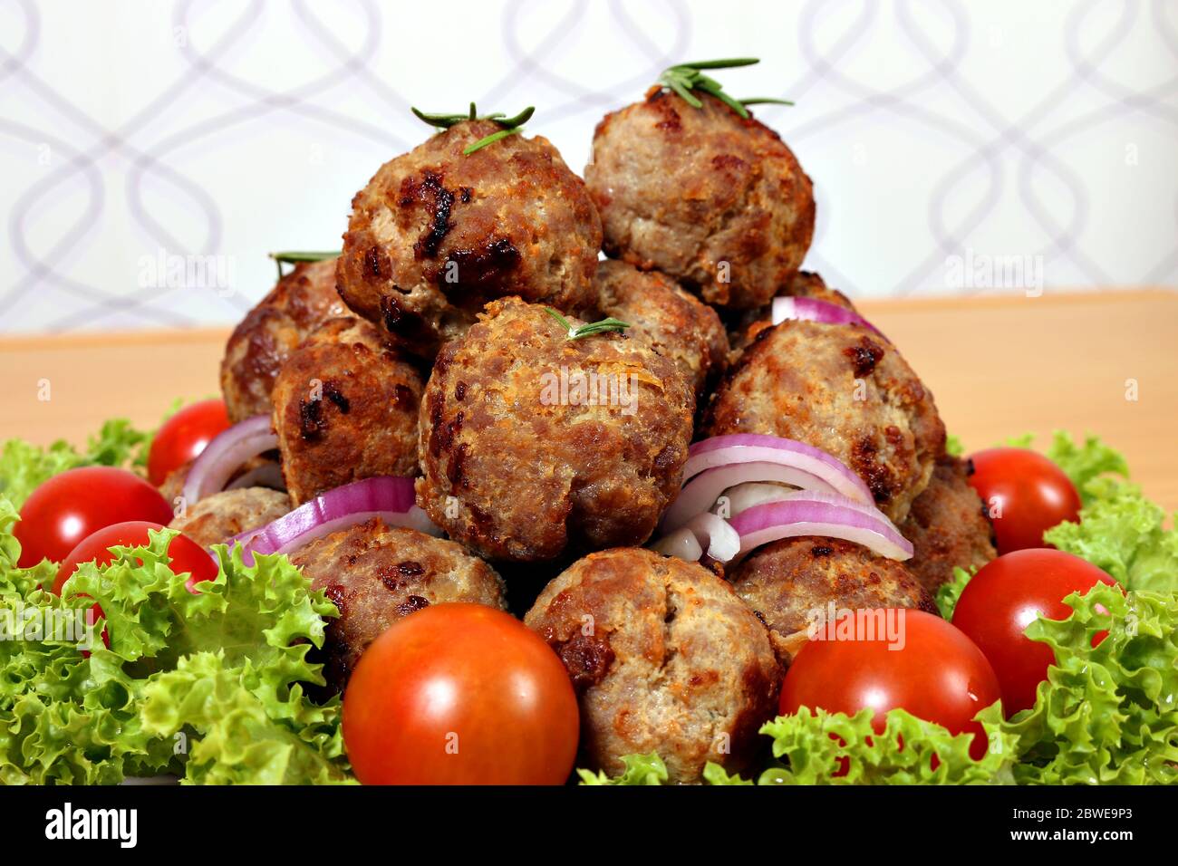 tasty meatballs with tomatoes and salad Stock Photo