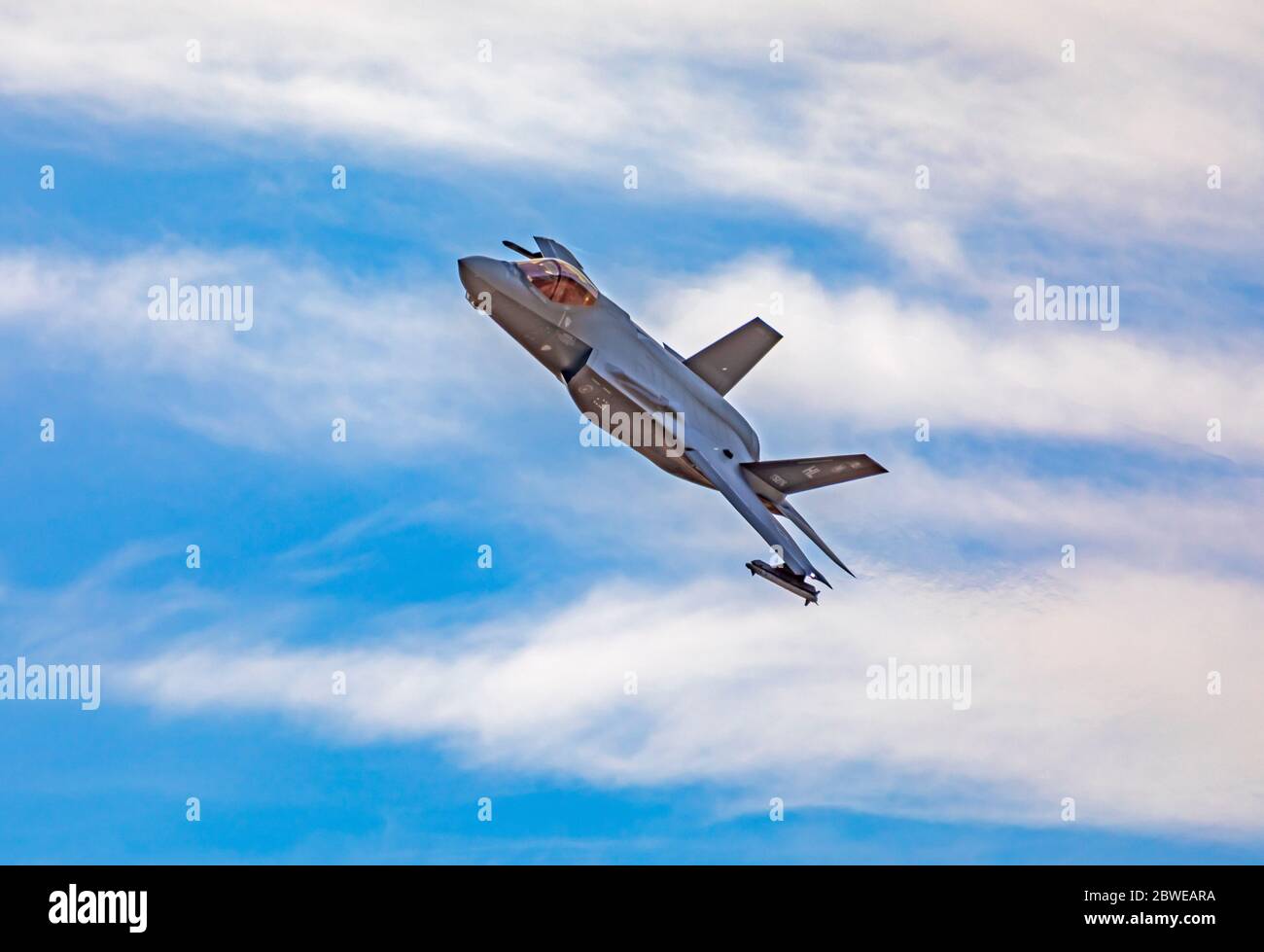 A Lockheed Martin F-35A Lightning II jet fighter banks left after taking off from Hill Air Force Base, Layton, Utah, USA. Stock Photo