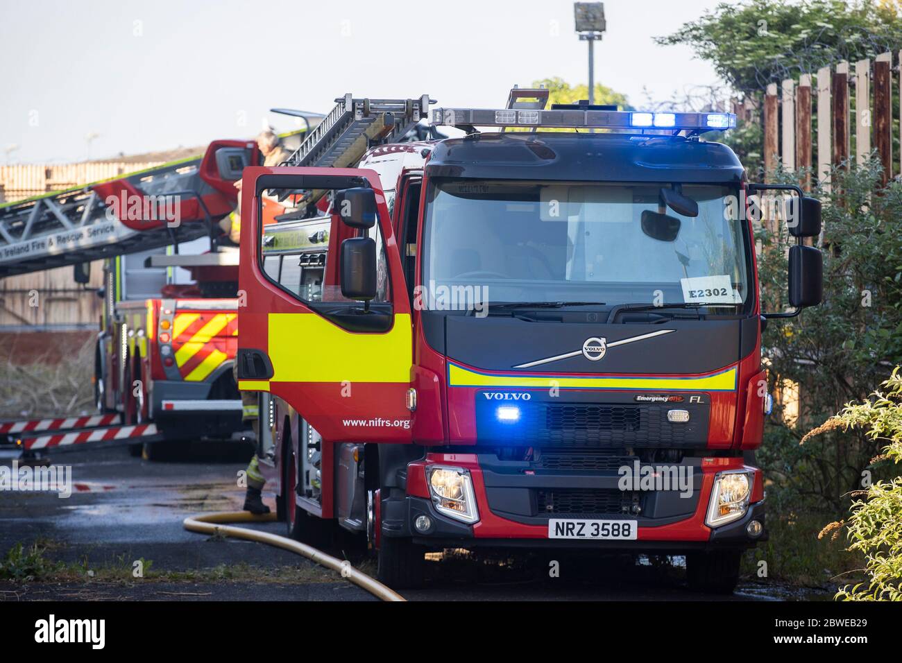 Northern Ireland Fire and Rescue Service firefighters tackling a large fire at Crumlin Road Courthouse in Belfast, Northern Ireland. Stock Photo