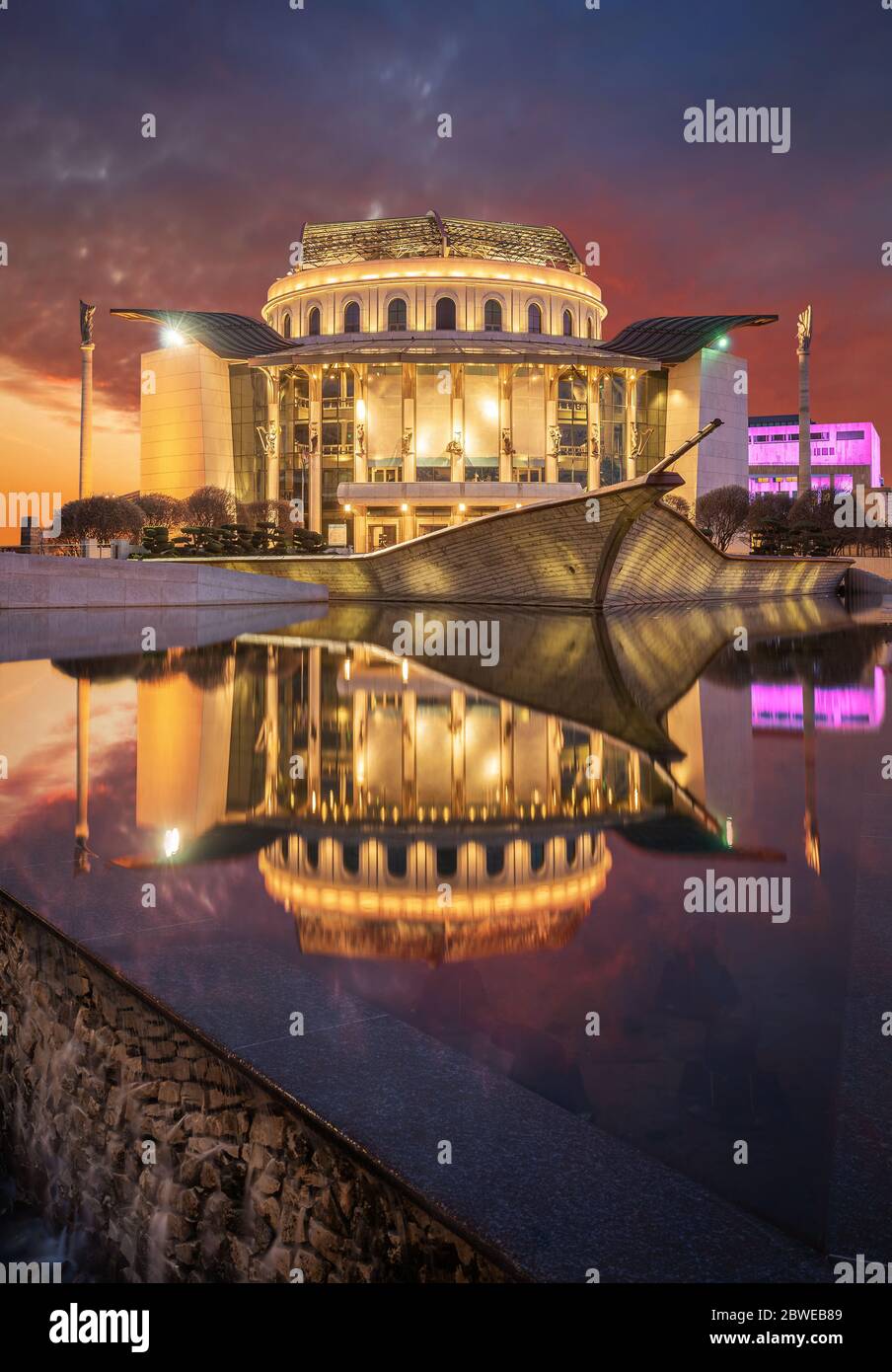 Budapest, Hungary -  National Theatre (Nemzeti Szinhaz) of Hungary with a dramatic colorful sunset above at spring time Stock Photo