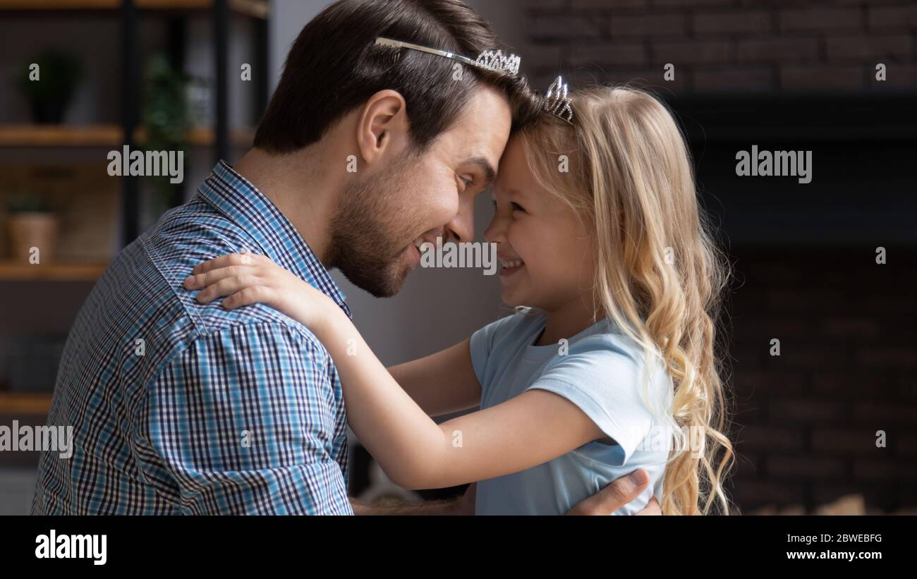 Happy father playing with excited little daughter Stock Photo