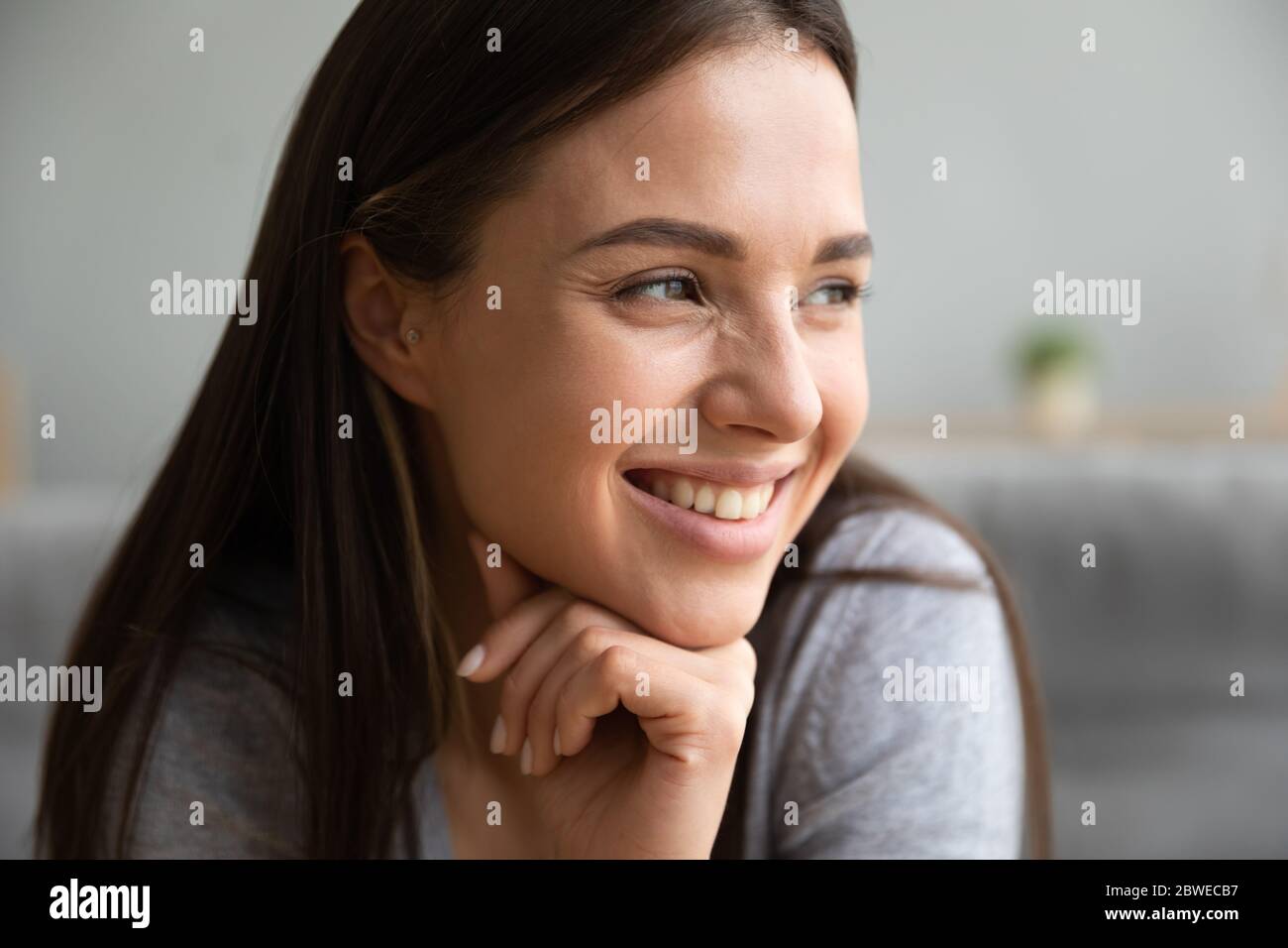 Close up image smiling positive young woman face Stock Photo