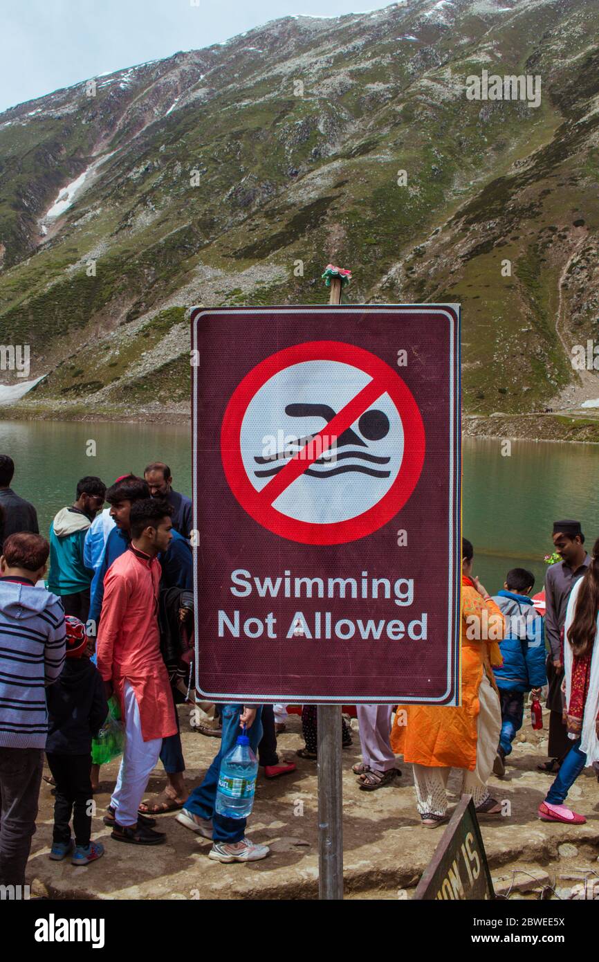 Swimming Not Allowed Waning Sign at Lake Saif ul Maluk, Naran Valley, Khyber Pakhtunkhua, Pakistan 6/26/2018 Stock Photo