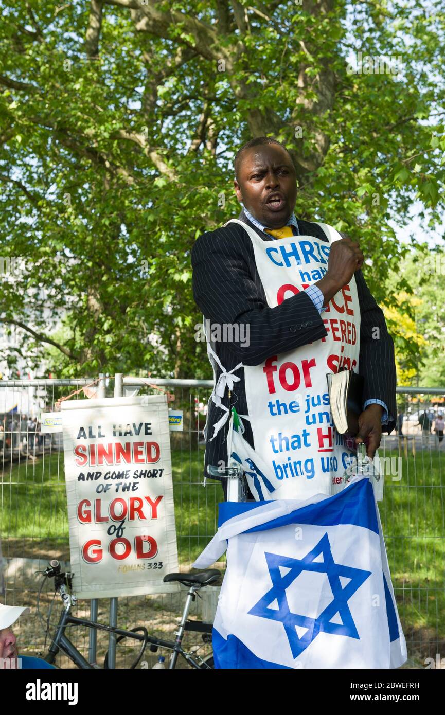 A christian preaching at Speakers' Corner which is situated near Marble
