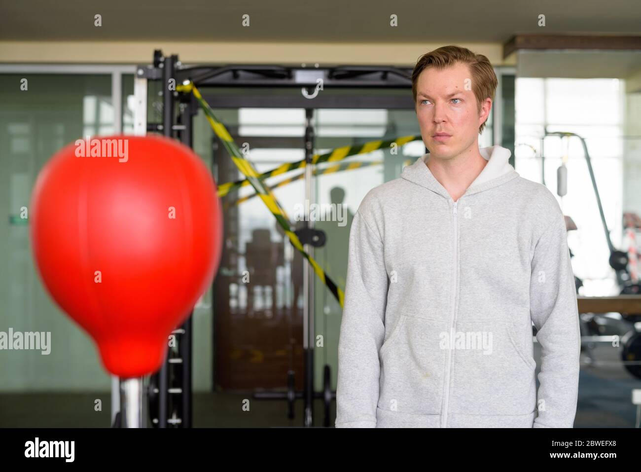 Young man thinking and ready for boxing at the gym Stock Photo - Alamy
