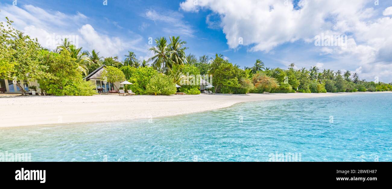 Maldives landscape. Tropical beach scene, blue sea and palm trees and white sand, summer vacation and holiday background concept. Exotic Stock Photo
