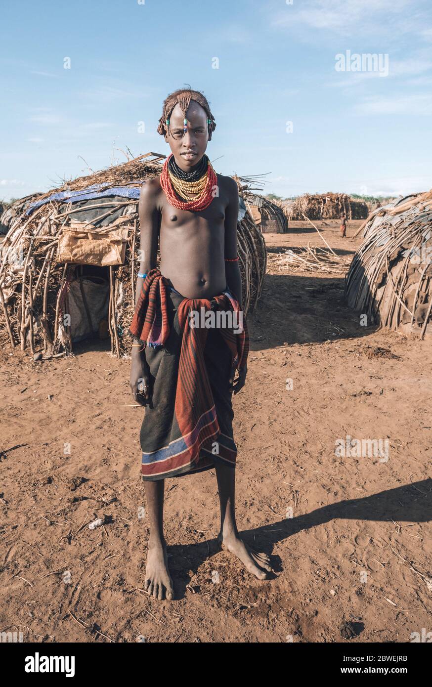 Omorate, Omo Valley, Ethiopia - May 11, 2019: Portrait of Teenager from the African tribe Dasanesh. Daasanach are Cushitic ethnic group inhabiting in Stock Photo