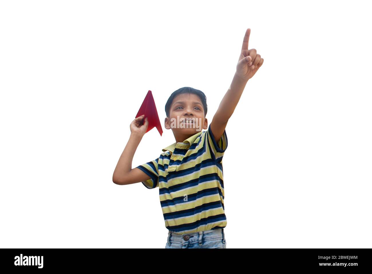 Boy playing with a paper plane and smiling Stock Photo