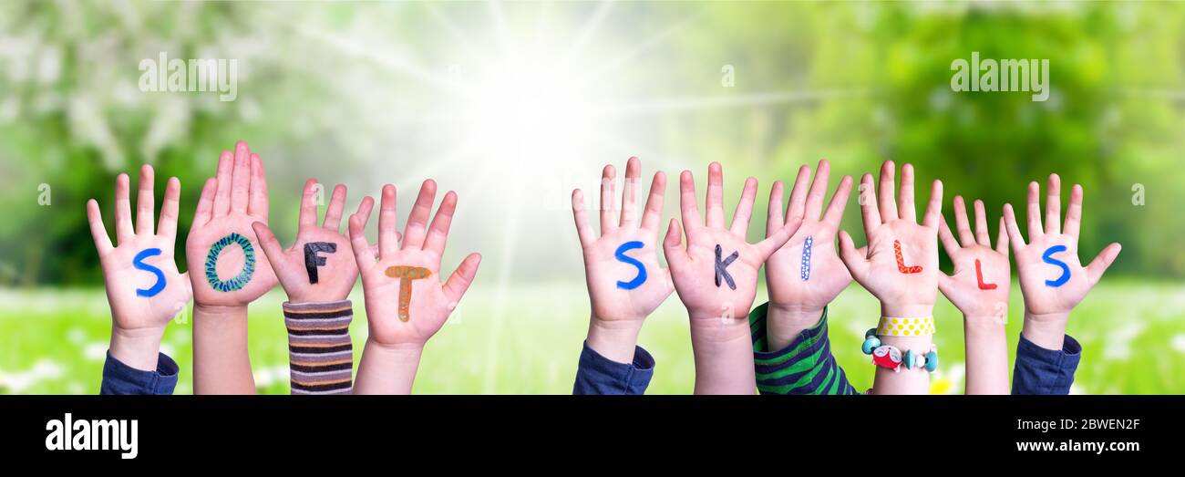 Children Hands Building Word Soft Skills, Grass Meadow Stock Photo