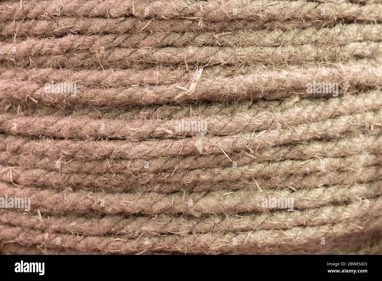 Natural hemp rope, hemp fiber woven into a thick thread closeup