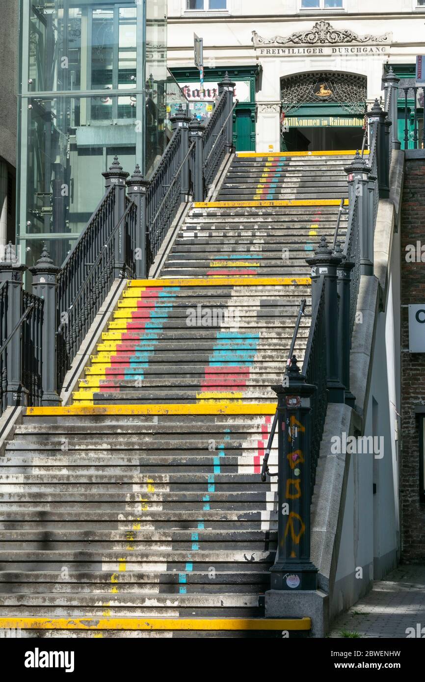 colorful painted staircase with old iron stair railing in Vienna Stock Photo
