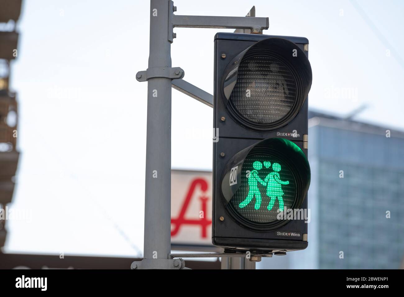 Vienna,Austria-April 03-202:Pedestrian Traffic Lights Original Green Lovers Signal in Vienna, Austria. Lighting Figures Holding Hands with Heart Symbo Stock Photo