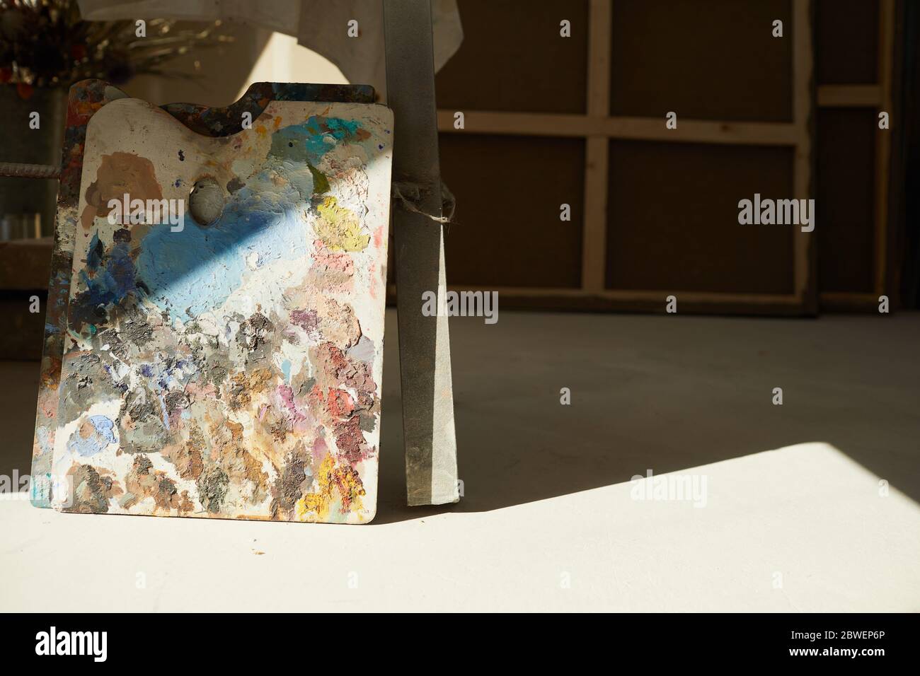 Background Image Of Colorful Artists Palette Lit By Sunlight In Empty Art Studio Interior Copy Space Stock Photo Alamy