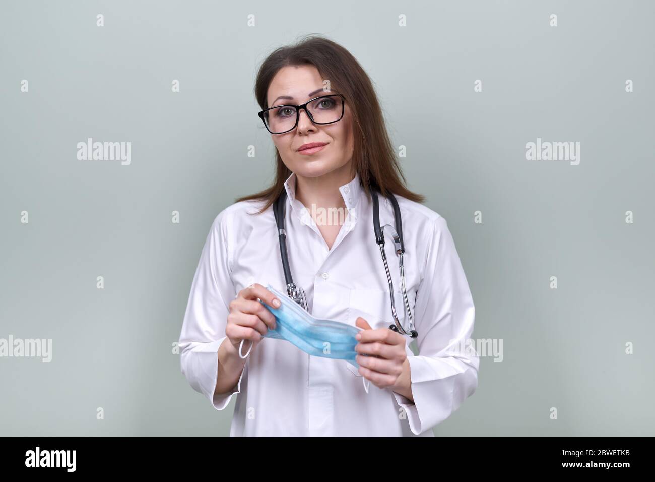 Professional puts face mask woman hi-res stock photography and images ...
