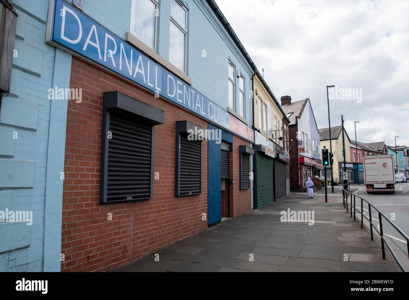 Sheffield UK April 09 2020 A lone woman walks the empty streets of
