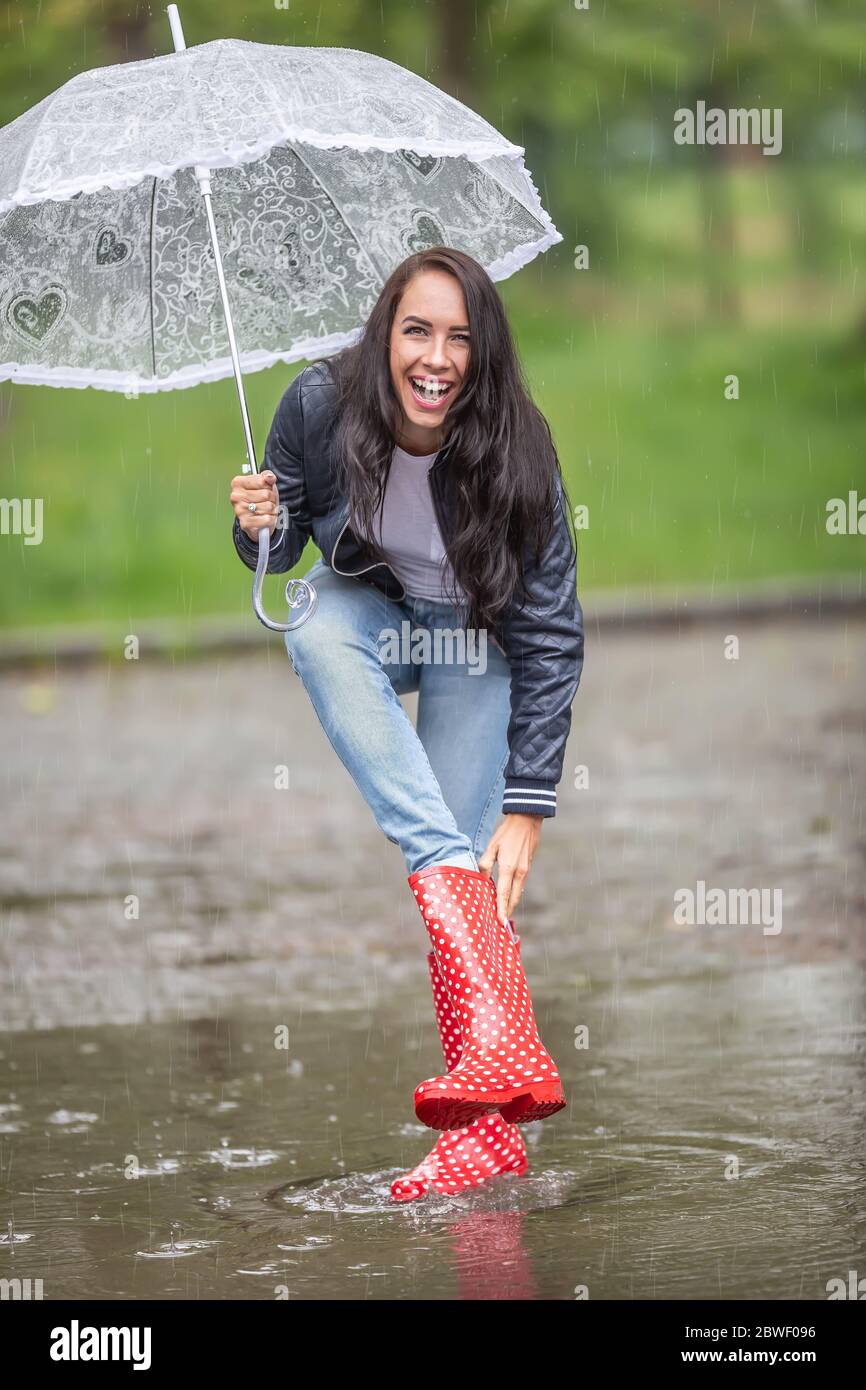 Woman taking off her boots hires stock photography and images Alamy
