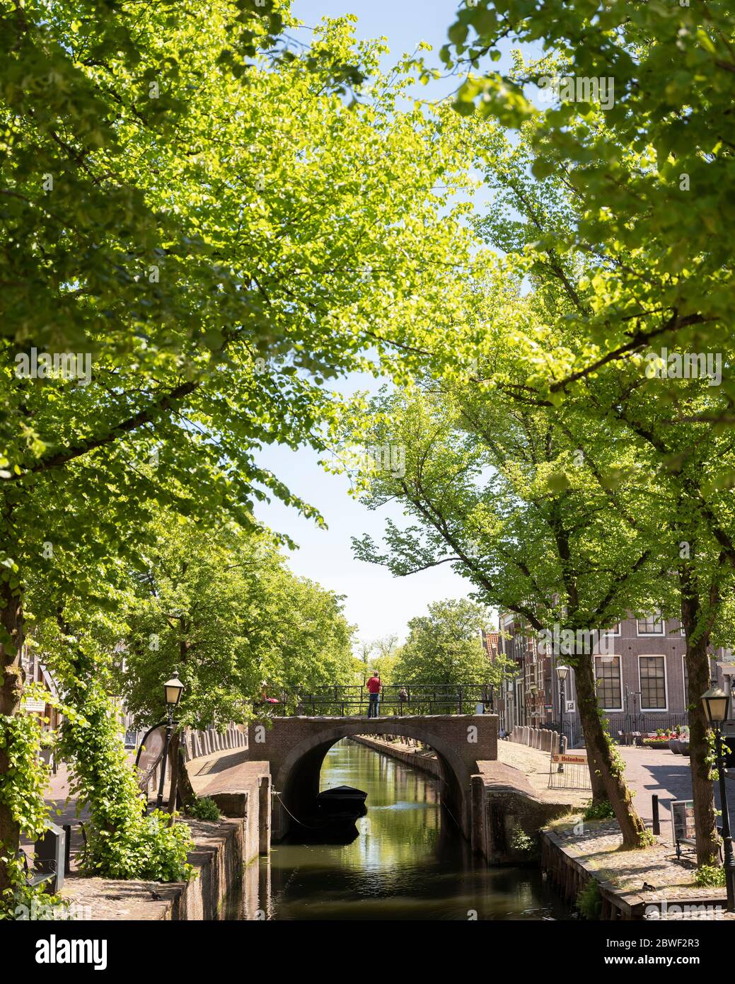 lonely figure on Dam in old dutch town of Edam in holland Stock Photo