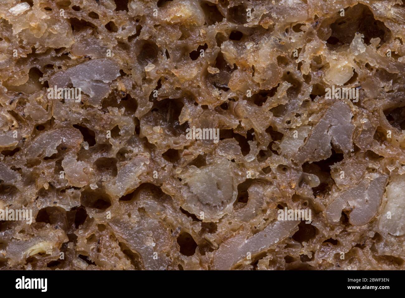 Extreme close-up photo of German dark rye bread, known as Pumpernickel. Royalty free stock photo. Stock Photo