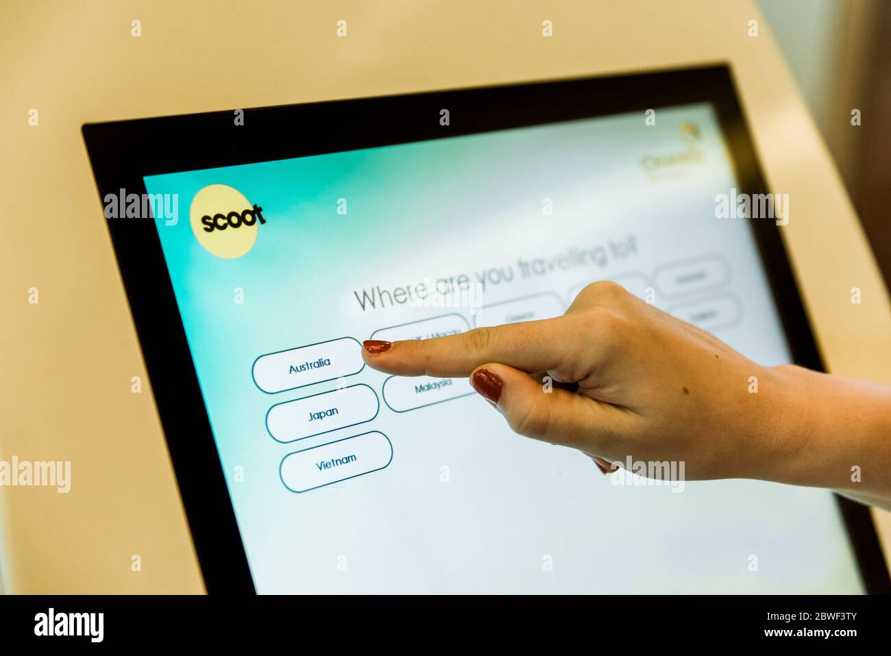 Singapore, Nov 2019: Self service electronic boarding system for Scoot airlines at Changi Airport. Self check-in machine. Printing boarding pass Stock Photo