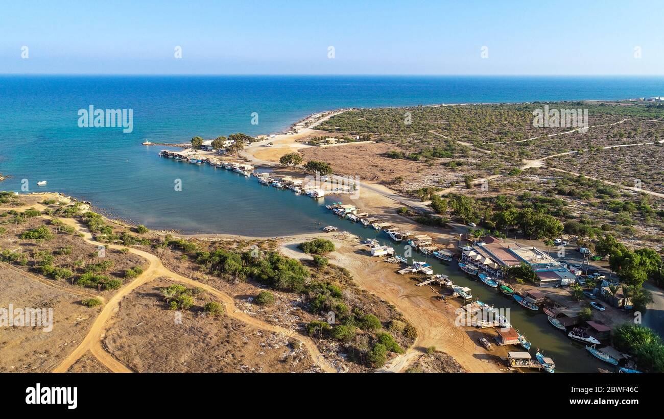 Aerial bird's eye view of Liopetri river to the sea (potamos Liopetriou), Famagusta, Cyprus. A landmark tourist attraction fishing village, natural fj Stock Photo