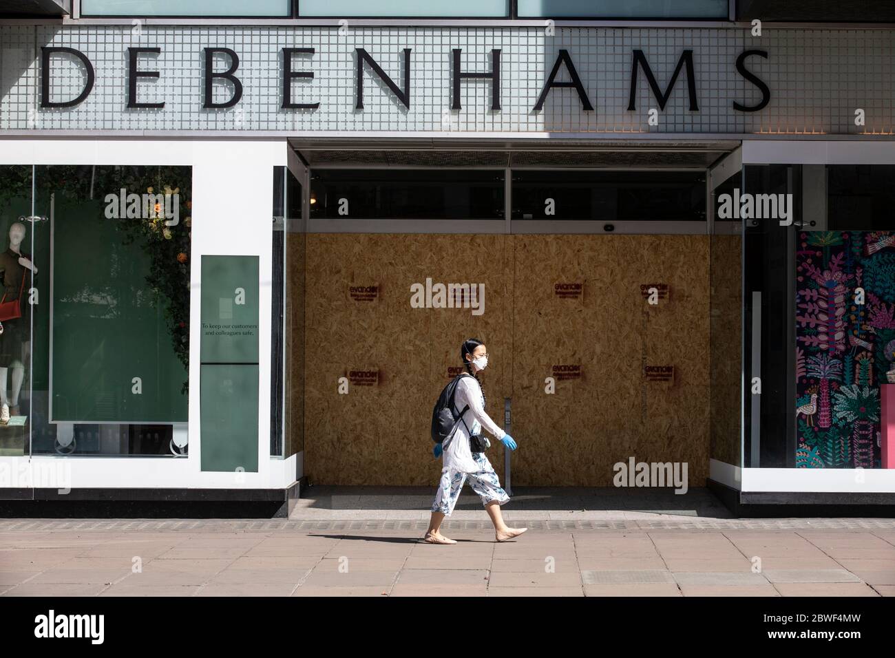 Pedestrians continue to wear facemarks along Oxford Street as businesses prepare to reopen on June 15th after the coronavirus lockdown, London, UK Stock Photo