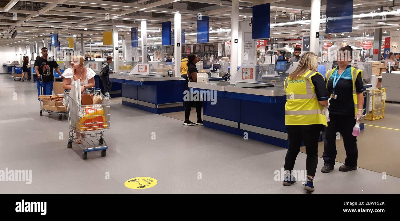 Customers leave the checkout area at the IKEA Lakeside store in Grays