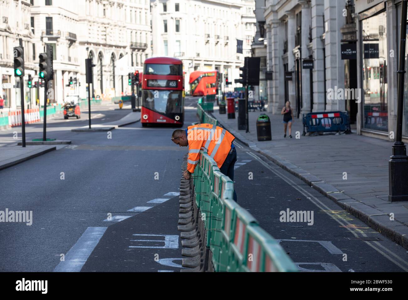 Regent Street pavements are widened for pedestrians to social distance as high streets prepare to reopen after the coronavirus lockdown, London, UK Stock Photo