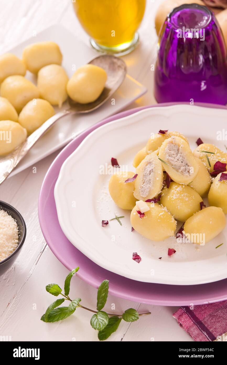 Potato gnocchi stuffed with radicchio and ricotta Stock Photo Alamy