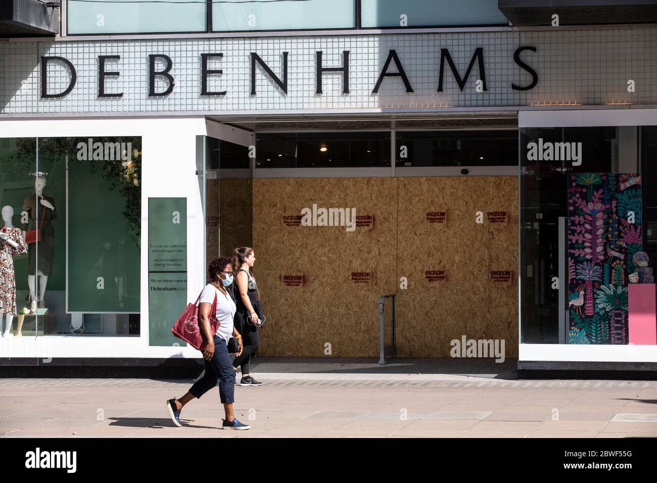 Pedestrians continue to wear facemarks along Oxford Street as businesses prepare to reopen on June 15th after the coronavirus lockdown, London, UK Stock Photo