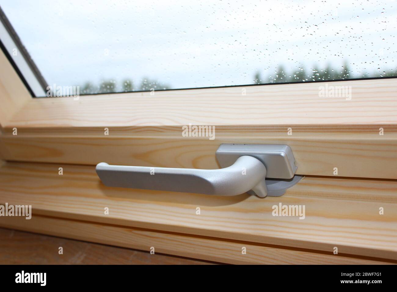 A Modern Sunroof. Handle for opening the attic window, closeup