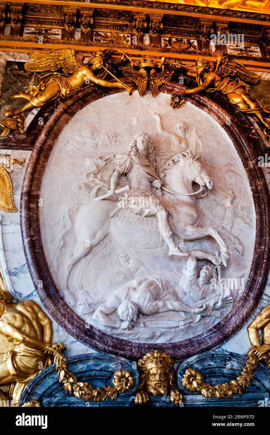 King Louis XIV on an oval horseback bias-relief in the War Room or Salon de  la Guerre at the Palace of Versailles in Paris, France Stock Photo - Alamy