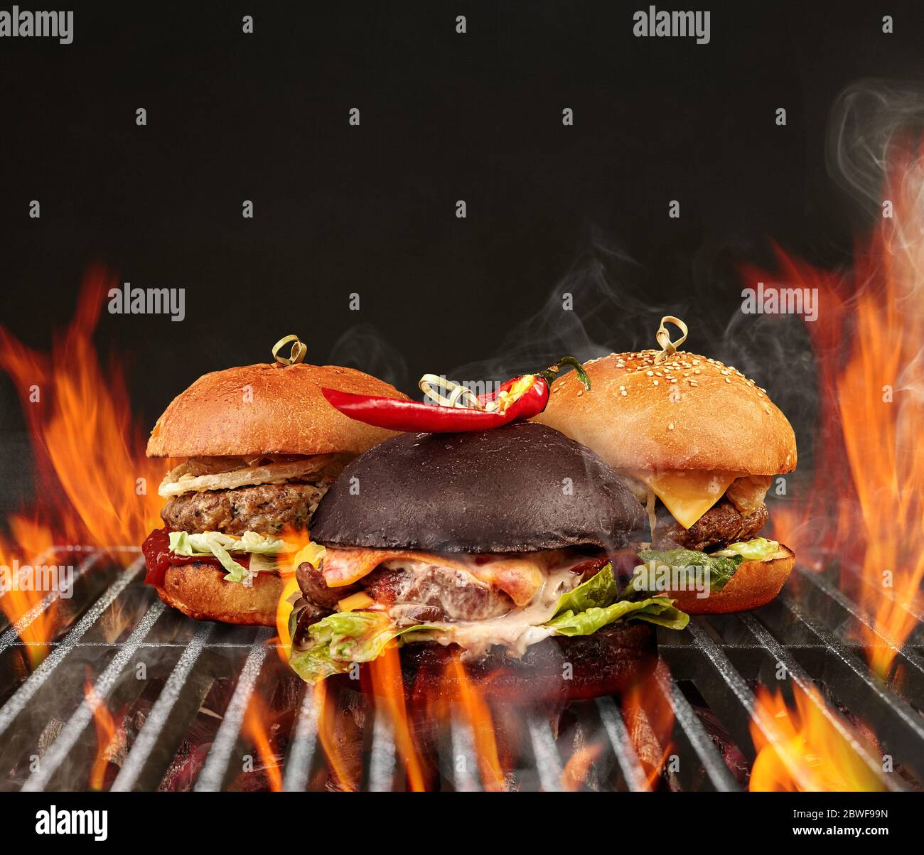 barbecue hamburgers on the grill
