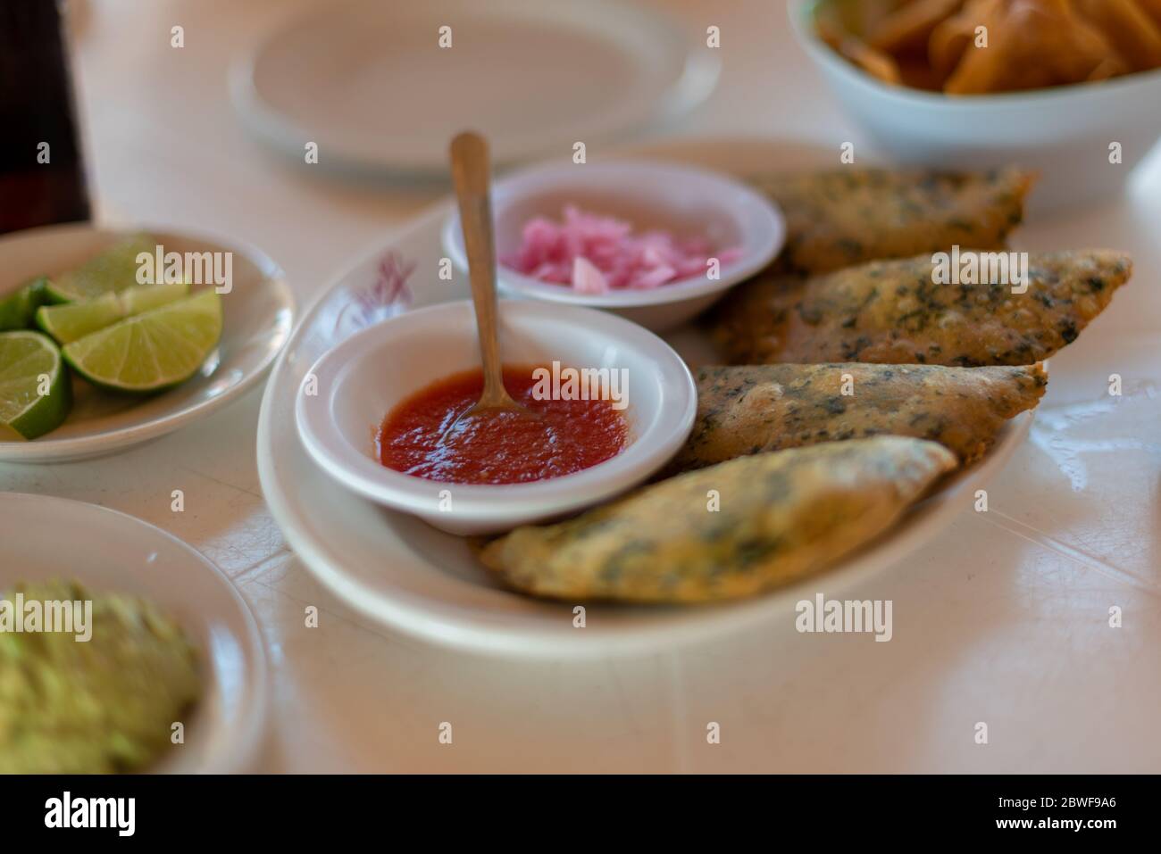 Empanadas - served with guacamole and lime - traditional Mexican/Argentinian food Stock Photo