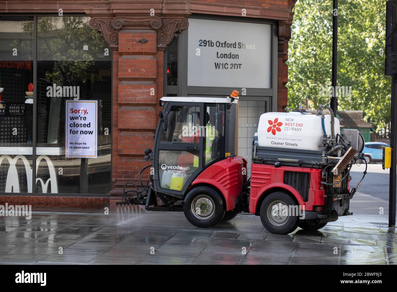 Pedestrian streets and pavements are cleaned ahead of the opening of retail shops in the West End of London after coronavirus, England, United Kingdom Stock Photo