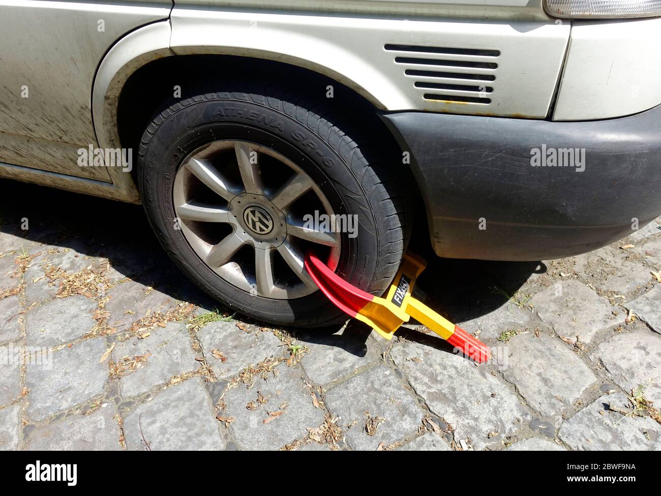 Wheel clamp, wheel boot, parking boot, or Denver boot is a device that