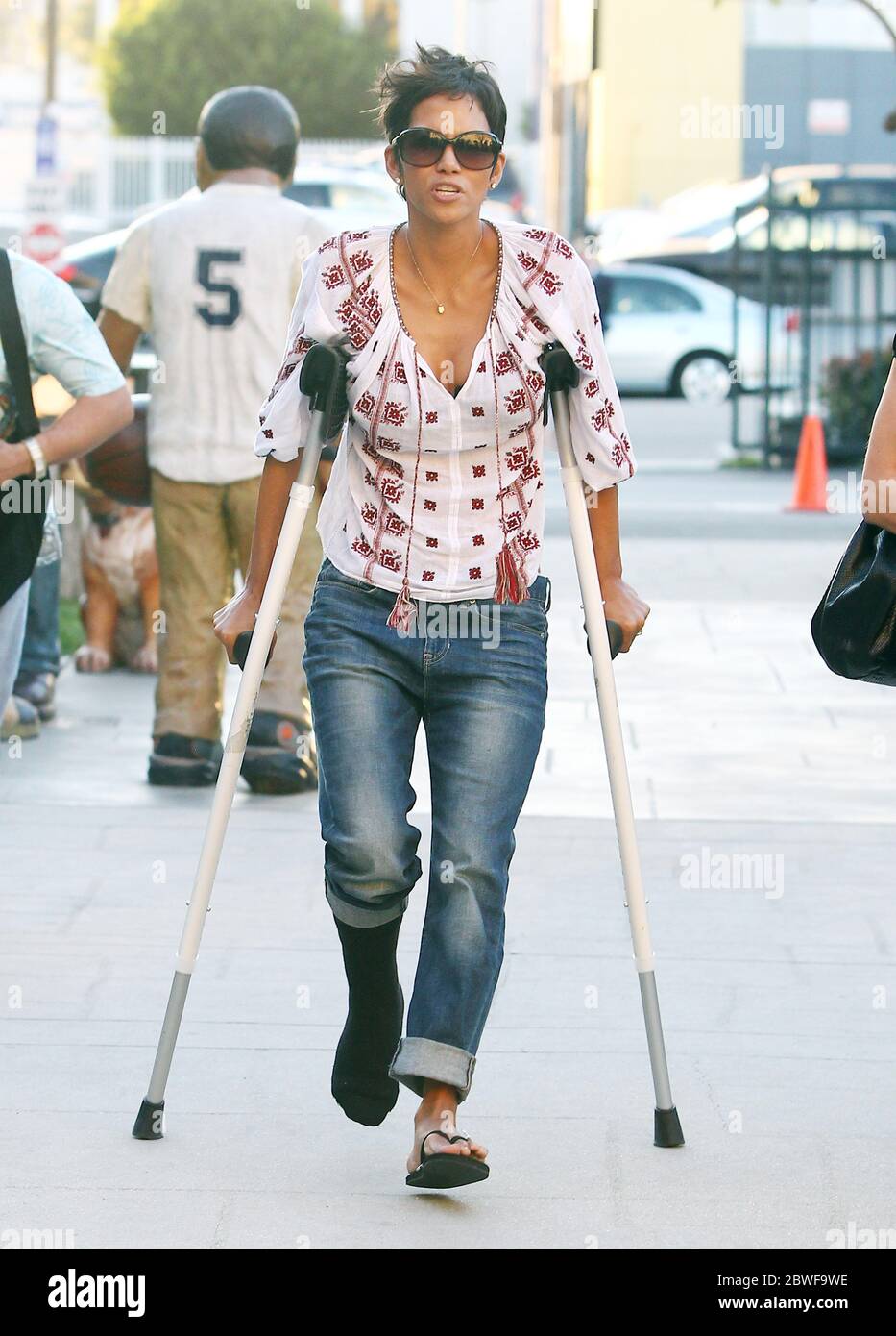Halle Berry still on crutches visits a school in Los Angeles, California. 9 February 2012 Stock