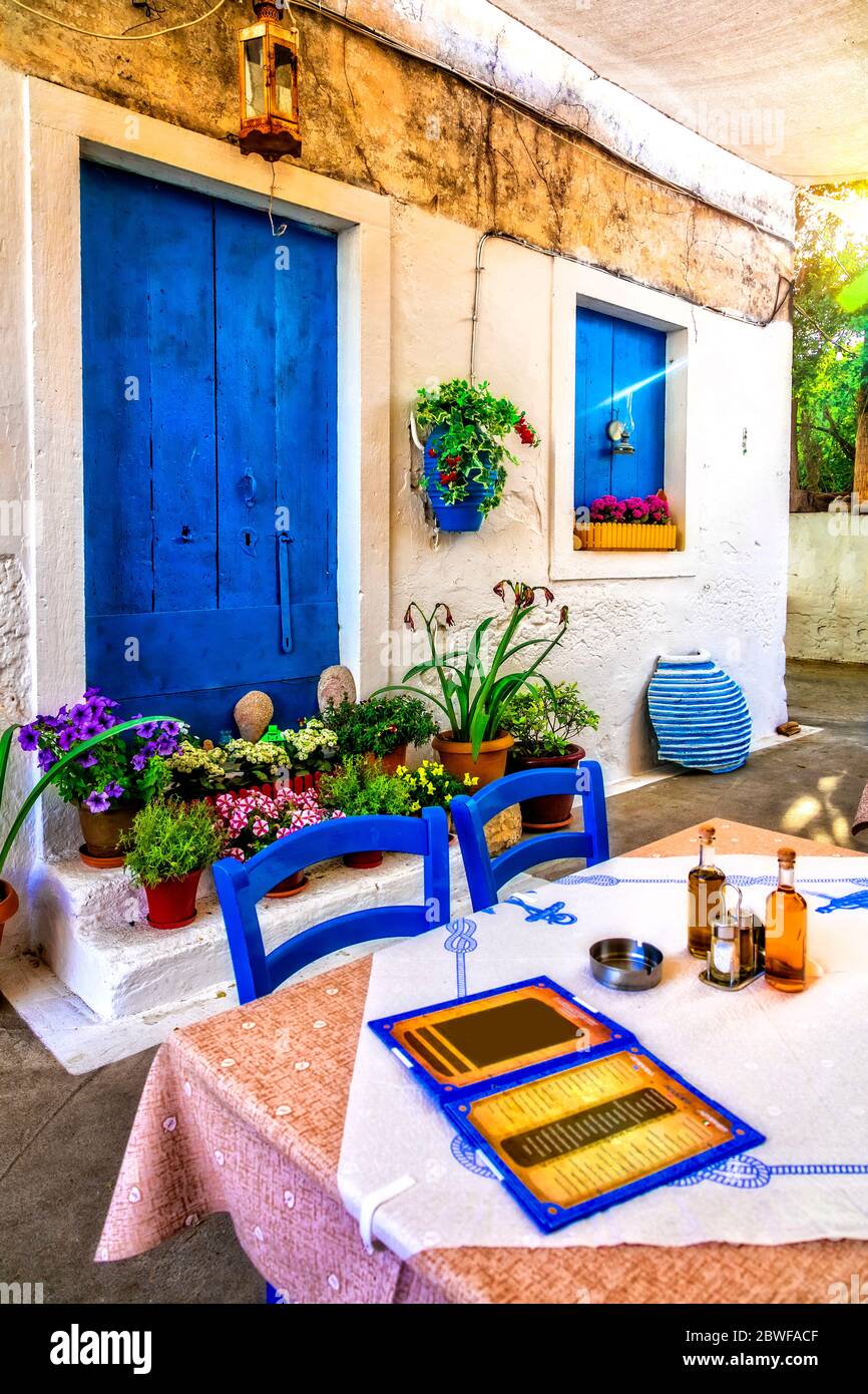 Typical street restaurants (taverns) of Greece. Paxos.IOnian island of Greece Stock Photo