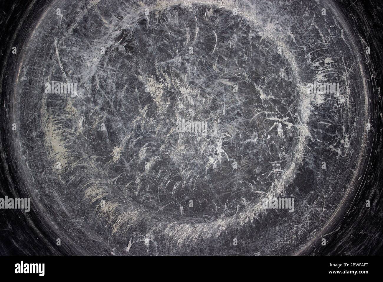 Circular brushed metal background. Distressed overlay texture of rusted peeled metal. Grey concrete texture with scratches, micro cracks. Grunge dust Stock Photo