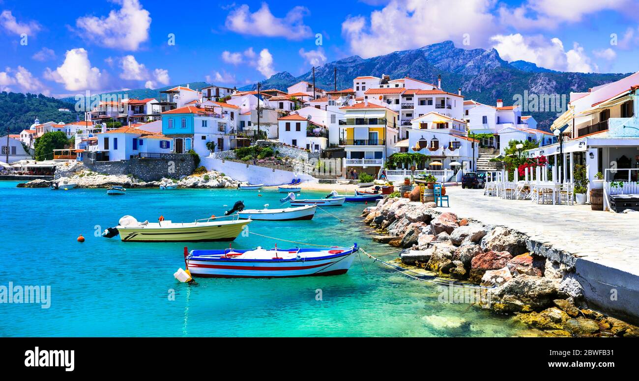 Traditional greek fishing villages. Beautiful Kokkari in Samos island. Popular tourist destination Stock Photo