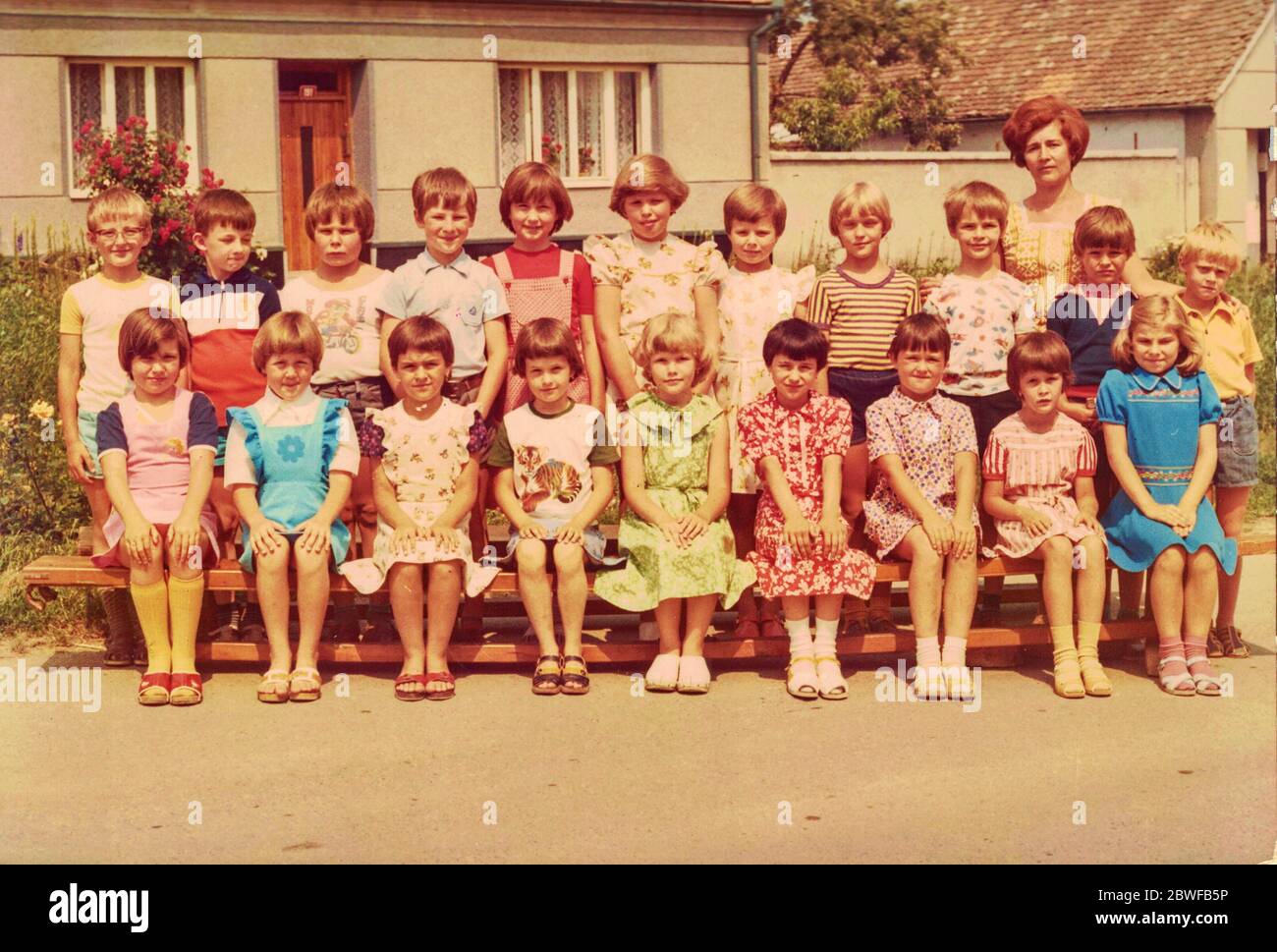 THE CZECHOSLOVAK SOCIALIST REPUBLIC - CIRCA 1980s: Retro photo shows pupils outdoors. They pose for a group photography Stock Photo